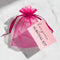 Pink organza bag with a pink tag labeled 'Hangover Survival Kit' on a white background