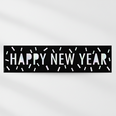Happy New Year banner against a white wall