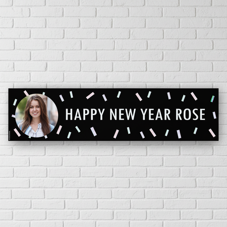 Happy New Year banner on a white brick wall