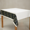 Happy New Year tablecloth on a table with a neutral background