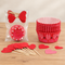 Heart toppers laid flat together on the wooden table
