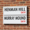 Henman Hill Murray Mound Street Signs on Red Brick Wall