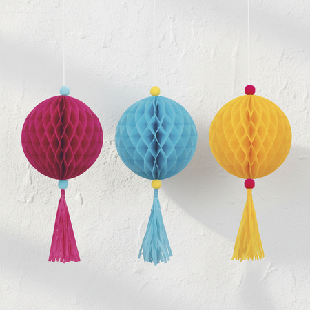Honeycomb Ball Decorations on White Textured Wall