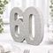 Close-up of a 20 cm silver glitter number 60 table decoration in an alcohol-free anniversary table setting