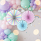 Unicorn tissue fan rosettes in pastel pink, blue and stripe with metallic silver edges, displayed in a pastel unicorn party scene