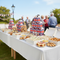 Union Jack party boxes stacked and filled with food on a catering table at a large British outdoor event