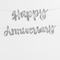 Smooth silver metallic foil-card Happy Anniversary letter banner displayed against a soft white wall