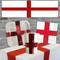England St George's flag napkin in party table setting against brick wall