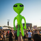 Inflatable Alien Held High at Music Festival Close Up