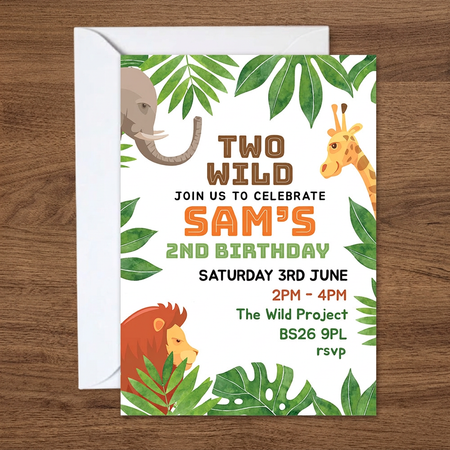 Invitation and envelope on a medium-dark wood background