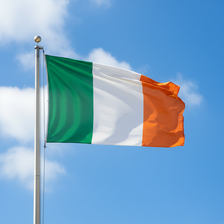 Irish Flag on Pole Against Blue Sky