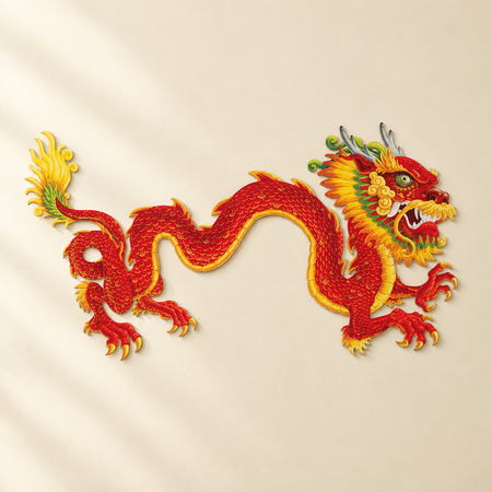 Jointed dragon cut-out on a cream wall