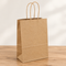 Kraft gift bag close up on a wood table with a neutral background, in square format