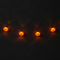 LED Pumpkin String Lights Glowing Against Dark Wall Halloween