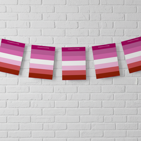 Lesbian Pride Bunting on White Brick Wall