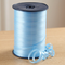 Light blue curling ribbon reel close up on a wooden table with a neutral background, in square format
