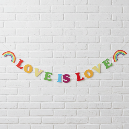 Love is Love Bunting on White Brick Wall