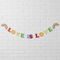 Love is Love Bunting on White Brick Wall
