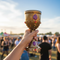 Medieval Goblet Held Up at Music Festival Close Up