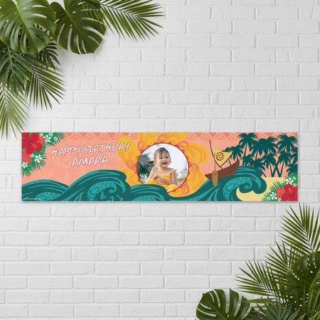 Moana Birthday Banner on White Brick Wall with Tropical Leaves