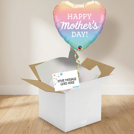 Mother’s Day balloon and open gift box on a wooden floor against a neutral wall with soft light and shade, in square format
