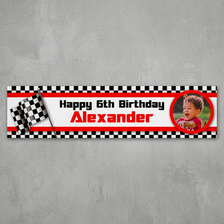 Motor racing birthday banner on a lightly textured grey wall with natural light and shade, in square format