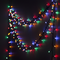 Multicoloured LED Fairy Lights Strung on Wall in Dim Light