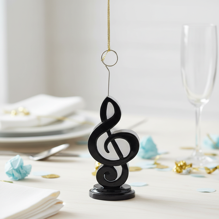 Musical note holder with balloon string