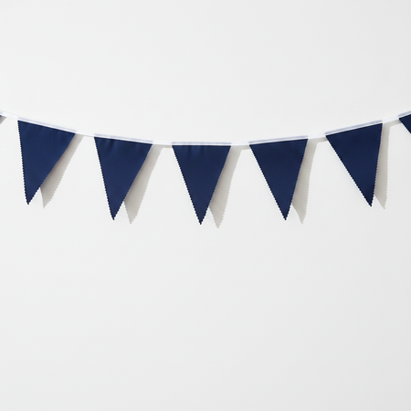 Navy triangular bunting on a white wall