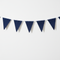 Navy triangular bunting on a white wall