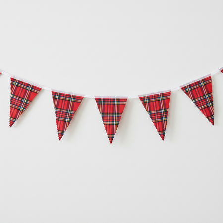 One length of Royal Stewart tartan fabric bunting on a white wall