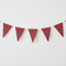 One length of Royal Stewart tartan fabric bunting on a white wall