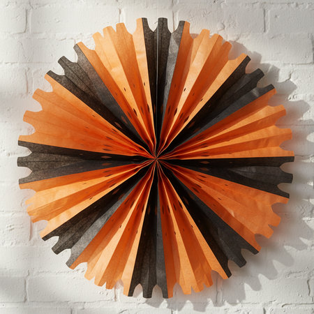 Orange Black Tissue Fan on White Wall