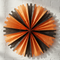 Orange Black Tissue Fan on White Wall