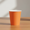 Orange Paper Cup Wood Table
