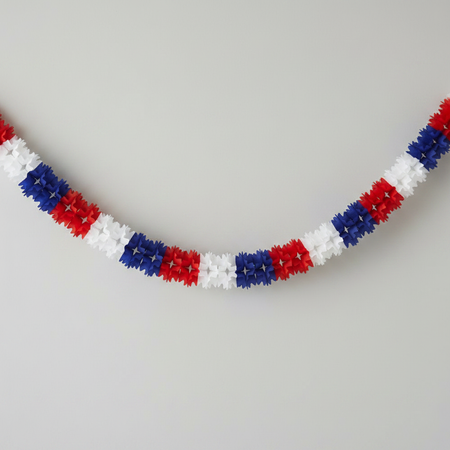 Paper Star Garland Bunting Against Wall