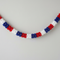 Paper Star Garland Bunting Against Wall