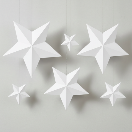 Paper stars against a pale grey wall