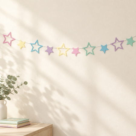 Pastel star bunting on cream wall with light and shade