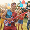 Person Air Guitaring with Union Jack Inflatable Guitar Daytime Party