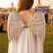 Person Wearing Silver Angel Wings from Behind at Festival