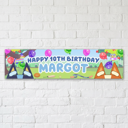 Personalised birthday banner on a white brick wall with soft light and shade, in square format