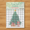 Personalised Christmas square grid poster on a wood table