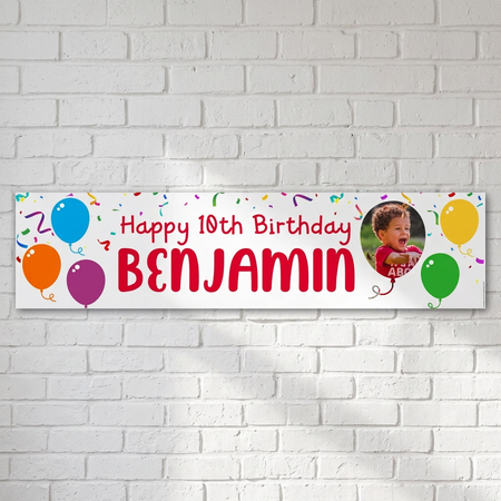Personalised photo birthday banner on a white brick wall with soft light and shade, in square format