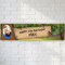 Personalised woodland photo banner on a white brick wall with soft light and shade, in square format