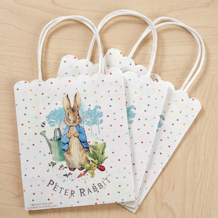 Peter Rabbit party bags on a wood background, keeping the original arrangement and perspective in square format