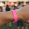 Plain Neon Pink Festival Wristband on Wrist Close Up