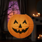 Pumpkin Paper Lantern Hanging Indoors with Light and Shade Close Up