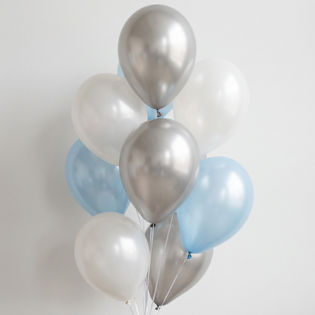 Realistic blue, silver and pearl white balloon bunch against a white wall with soft light and shade, in square format