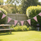 Red and white gingham bunting in garden setting